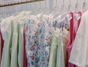 White Blue and Yellow Floral Dress Hanging on Clothing Rack
