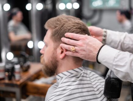 Photo of a Barber Giving a Haircut