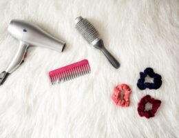 Grey Hair Blower Near Pink Hair Combs and Scrunchies